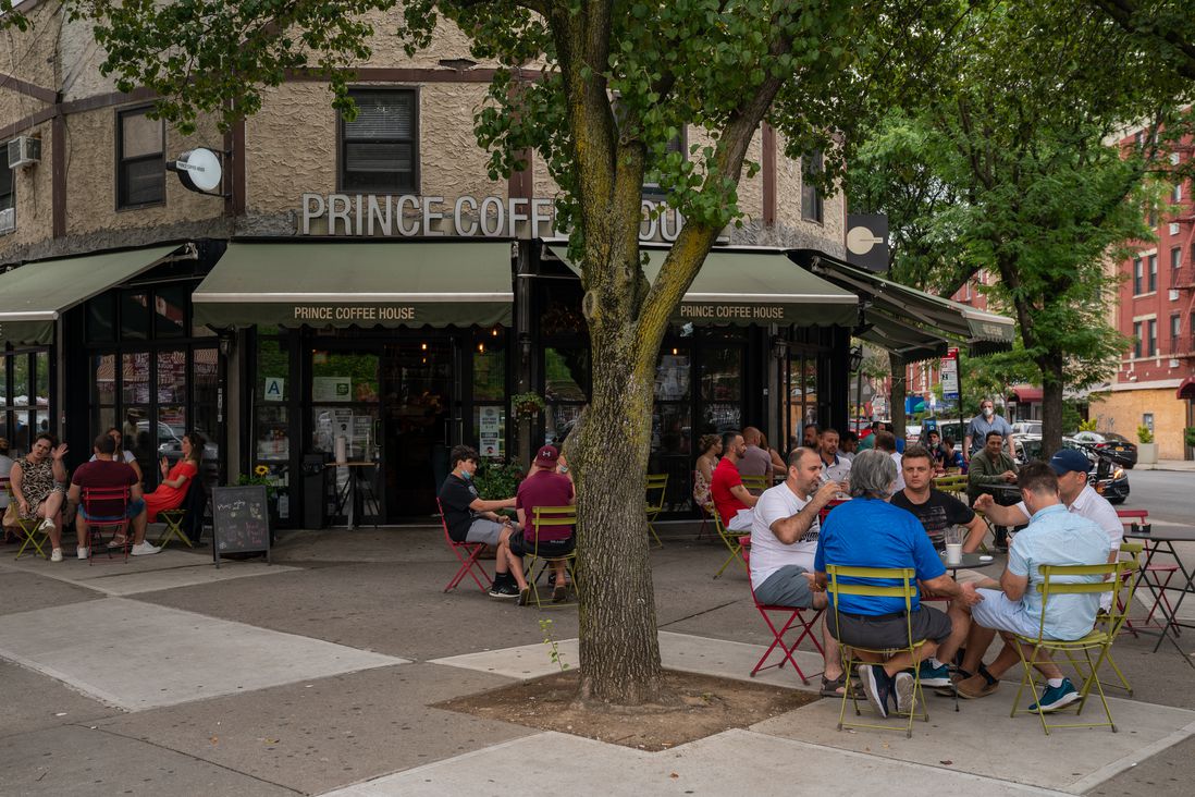 OUtdoor sidewalk seating at a coffee house